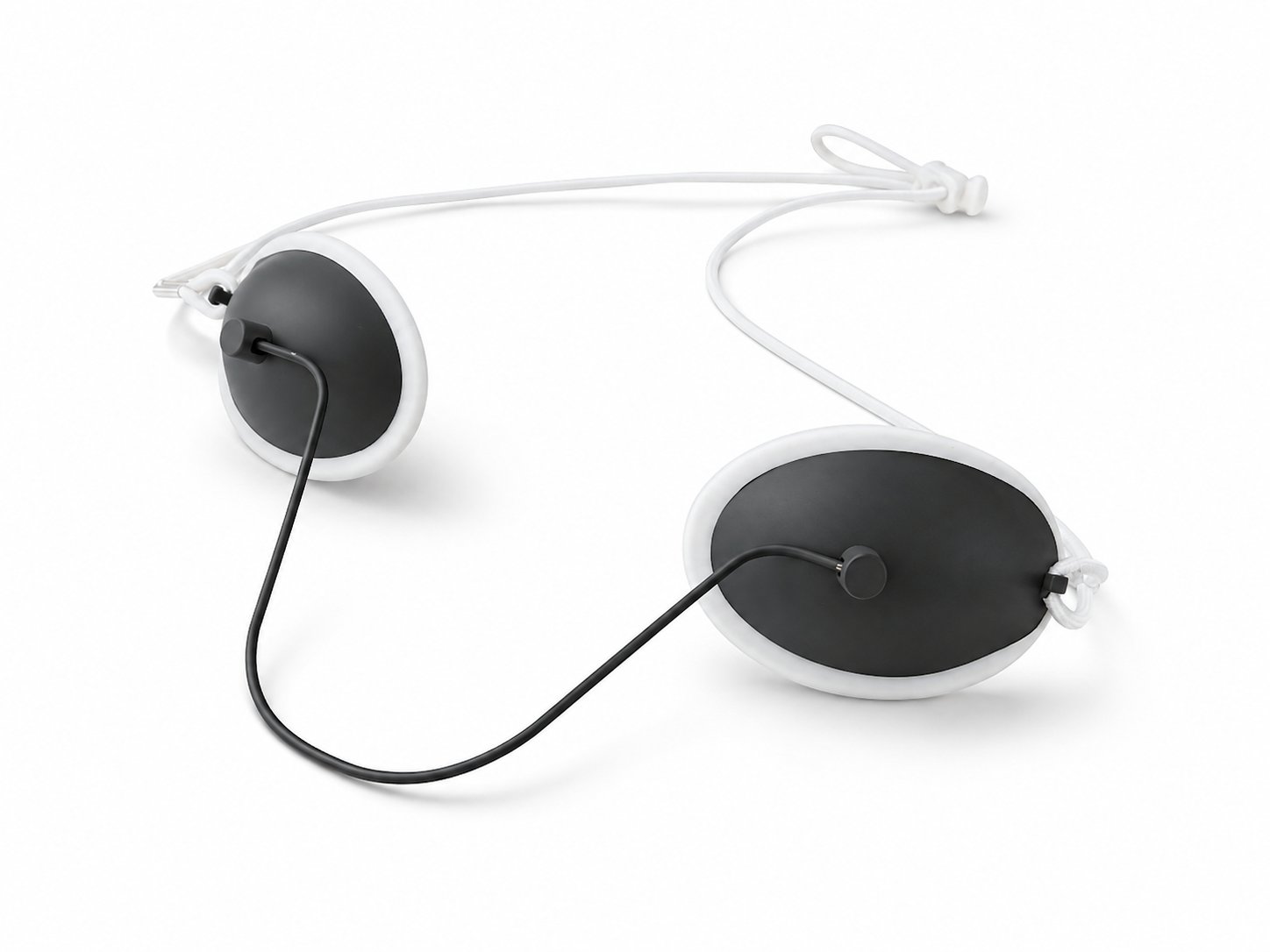 Innovia patient laser eyewear: a pair of oval opaque eye shields with a soft white rim and an adjustable cord strap