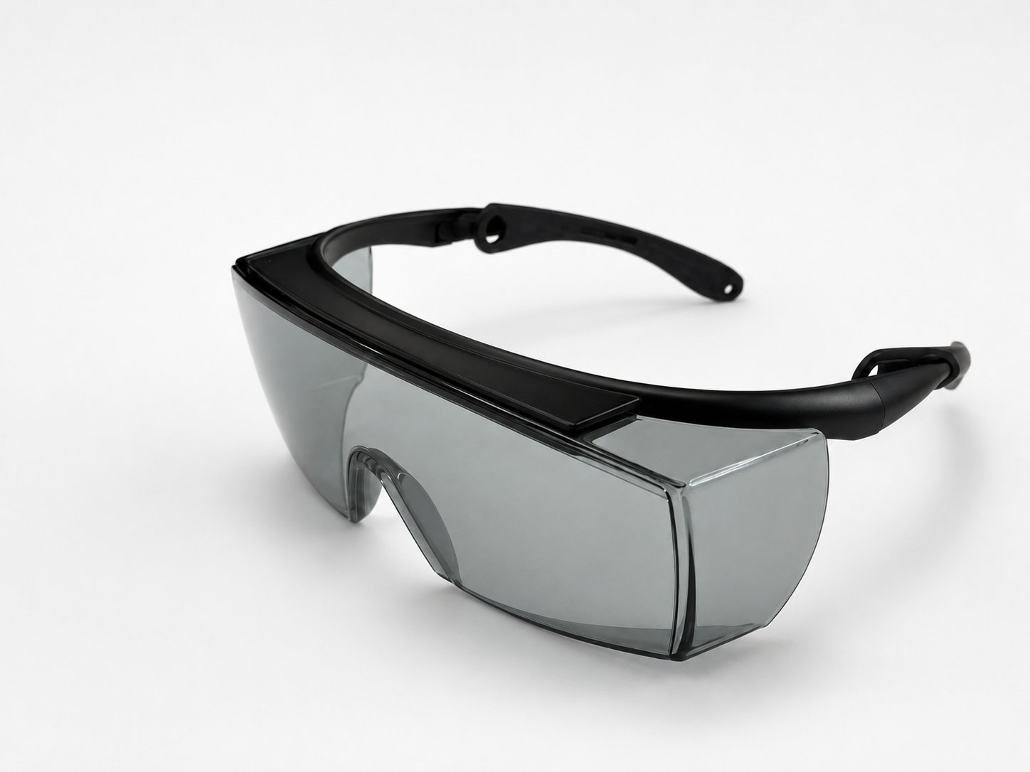 Innovia laser safety eyewear, model LP-HOL: wrap around protective spectacles with tinted lenses, side shields and adjustable temple arms, sized to fit over prescription glasses